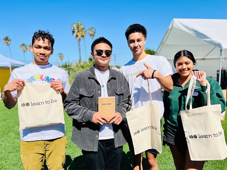 Students Hold Learn To Be Bags