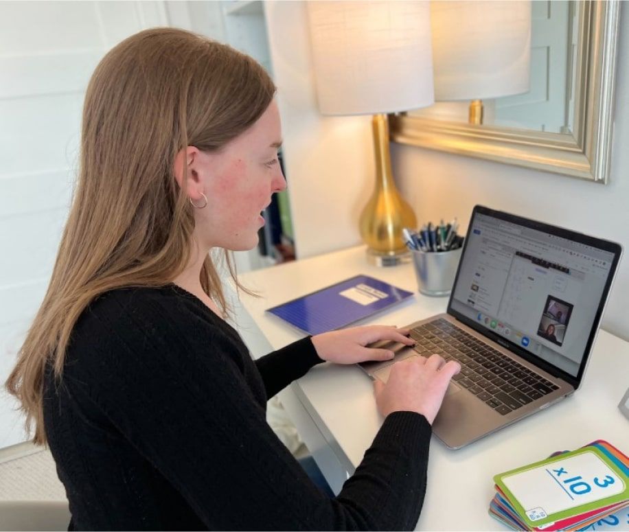 Tutor talks online with a student