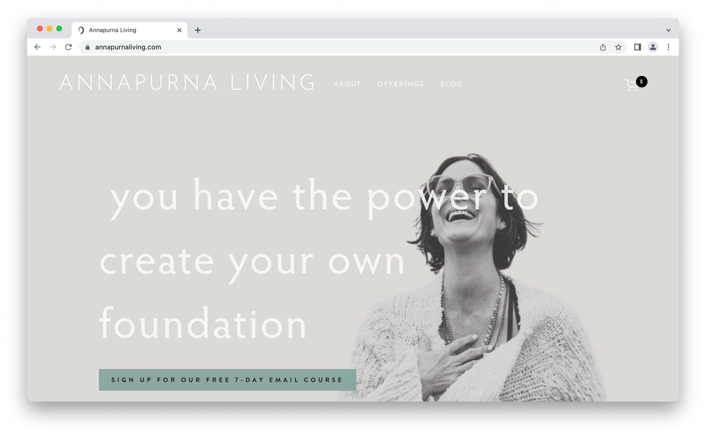 Screenshot from Annapurna Living, woman laughing with grey background