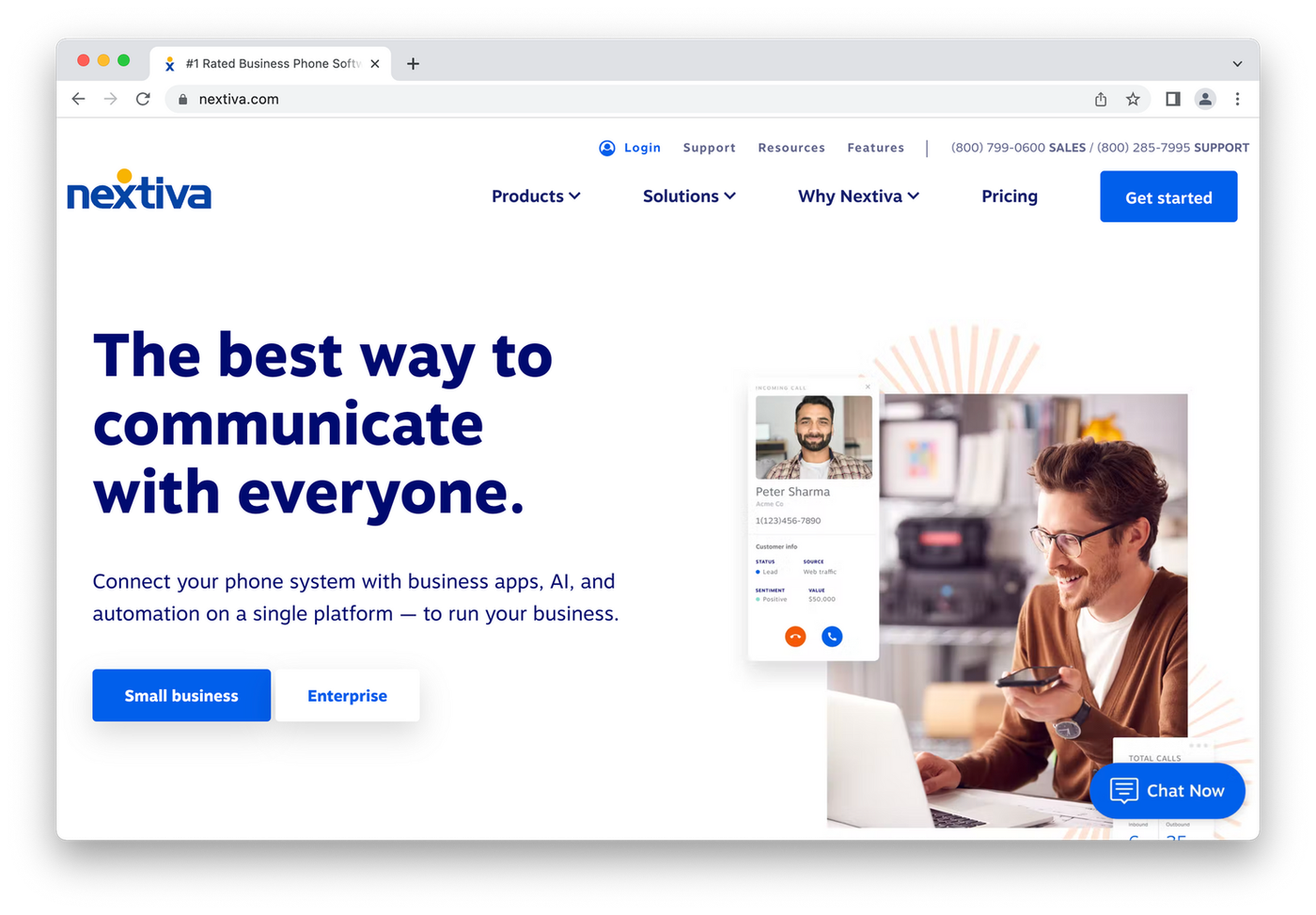Nextiva homepage, man on phone by computer