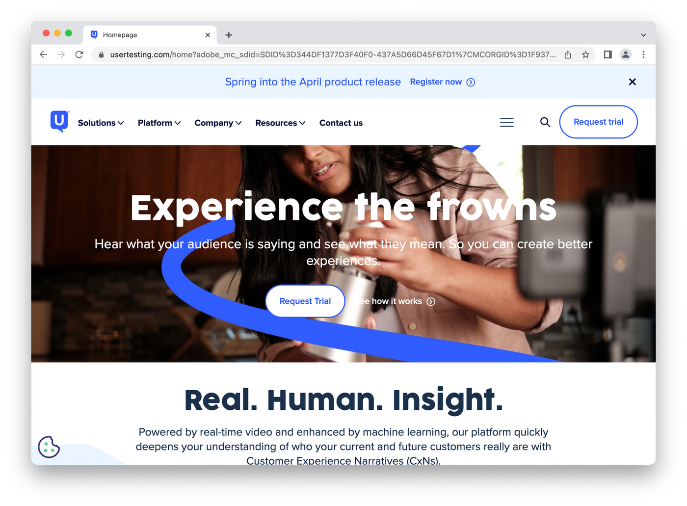screenshot of usertesting homepage, woman testing product)