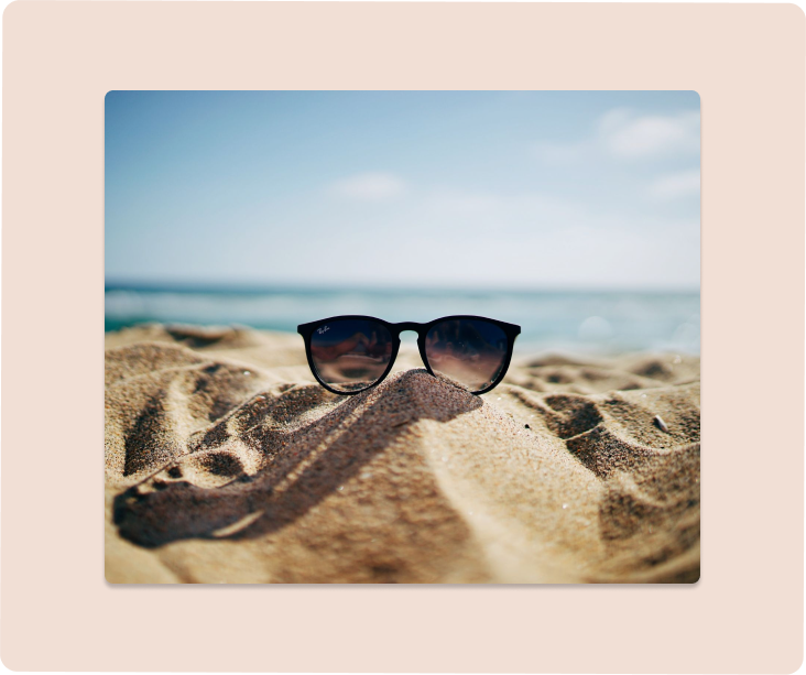 Sunglasses on sand at the beach