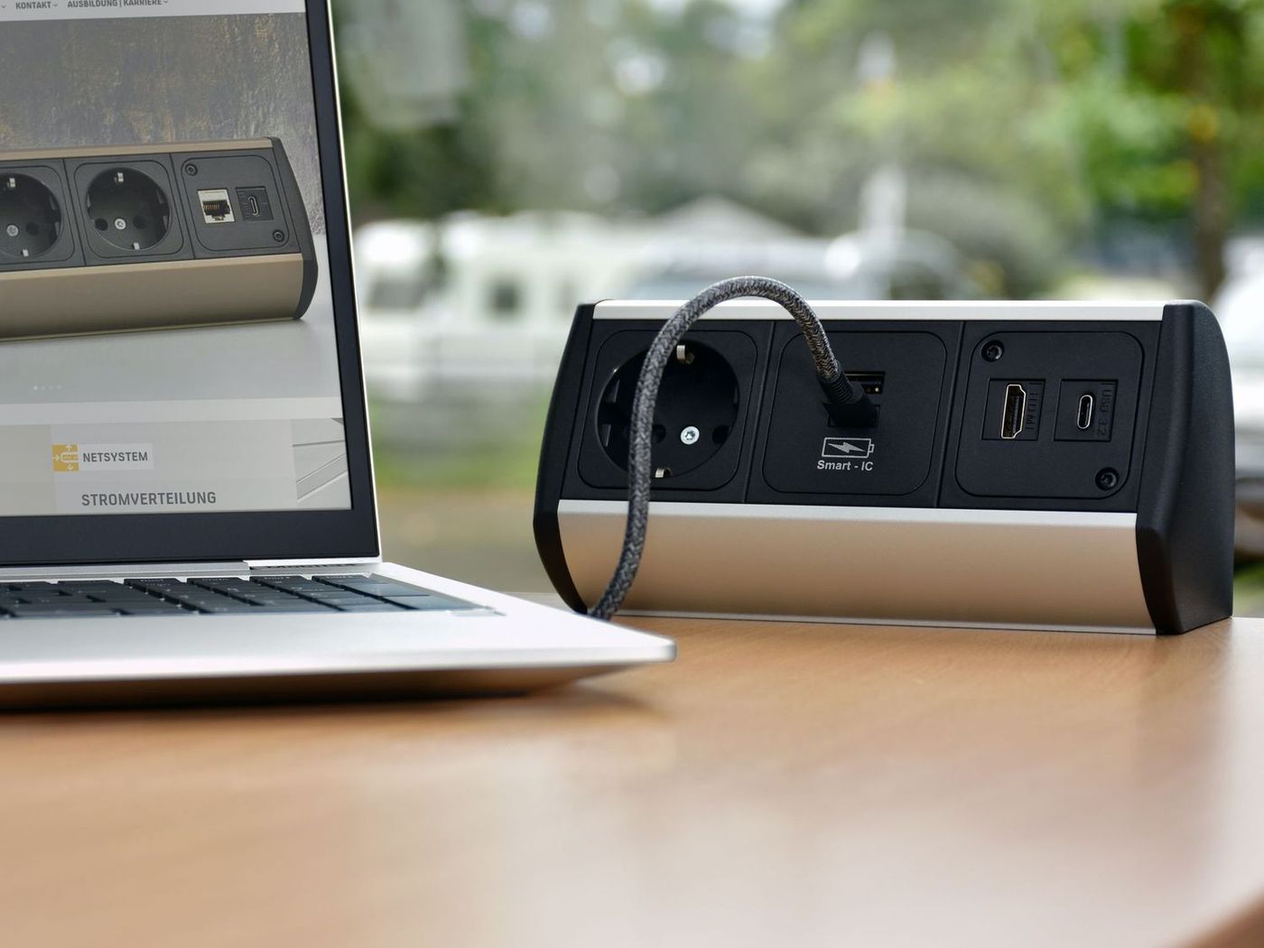 USB-C hub plugged into laptop on desk