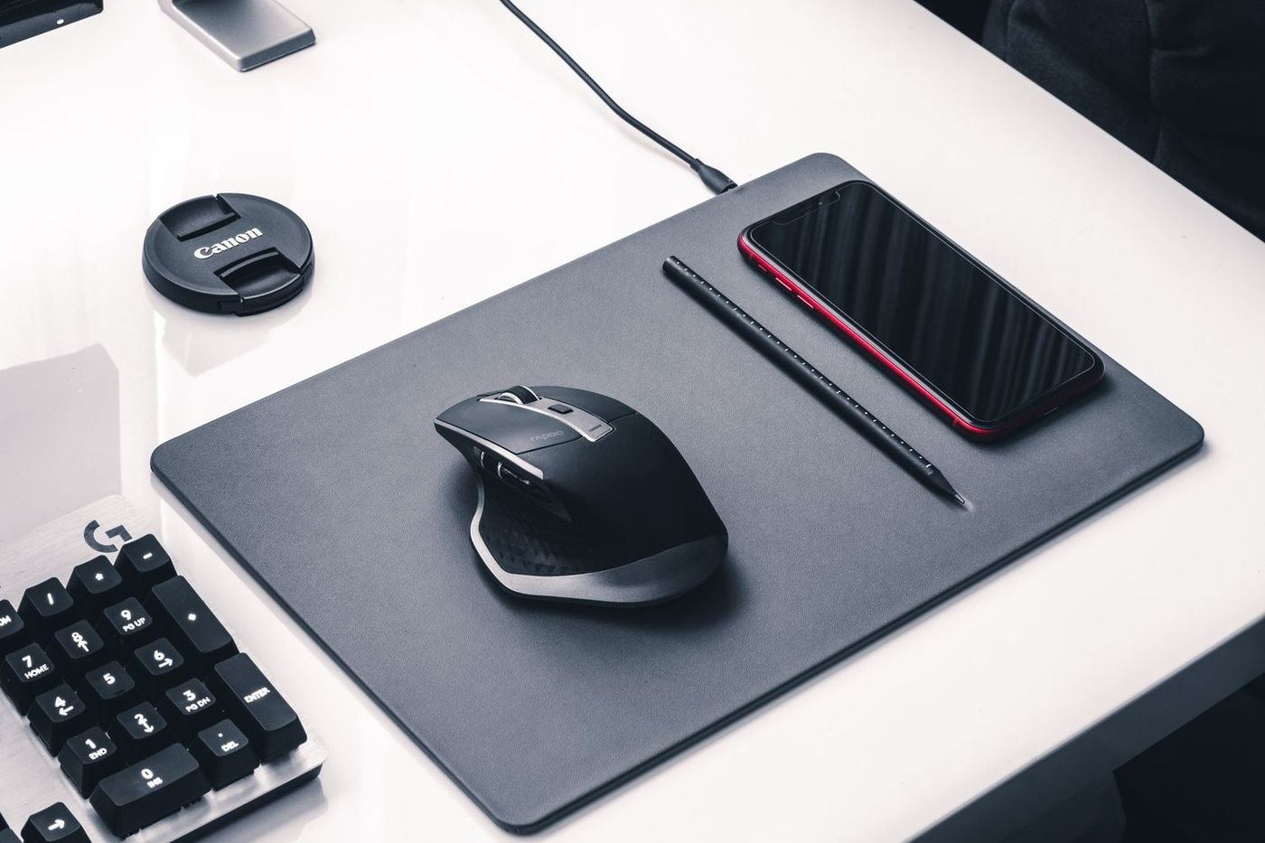 Wireless mouse next to headphones