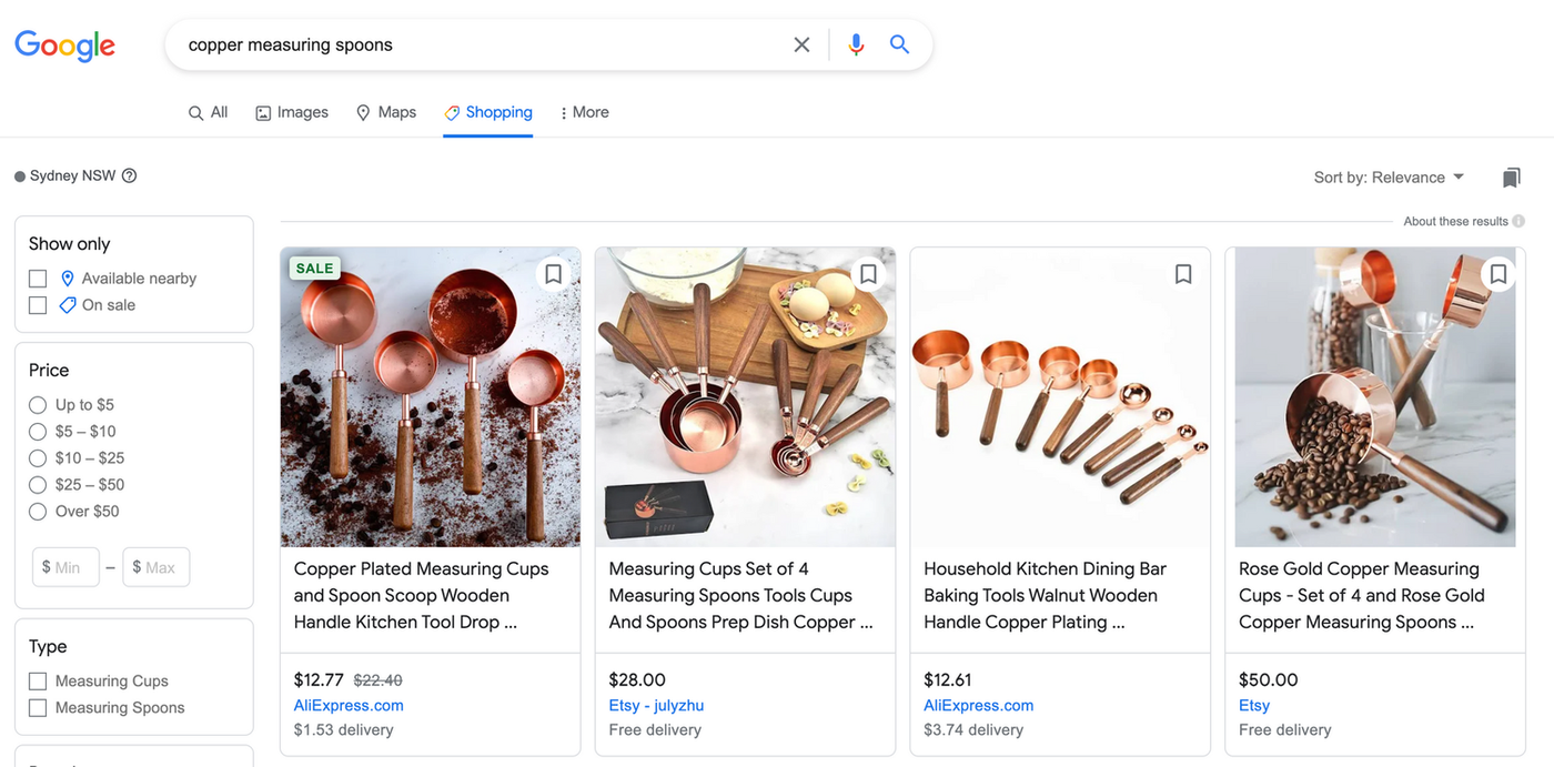 images of copper measuring spoons with wooden handles on google search