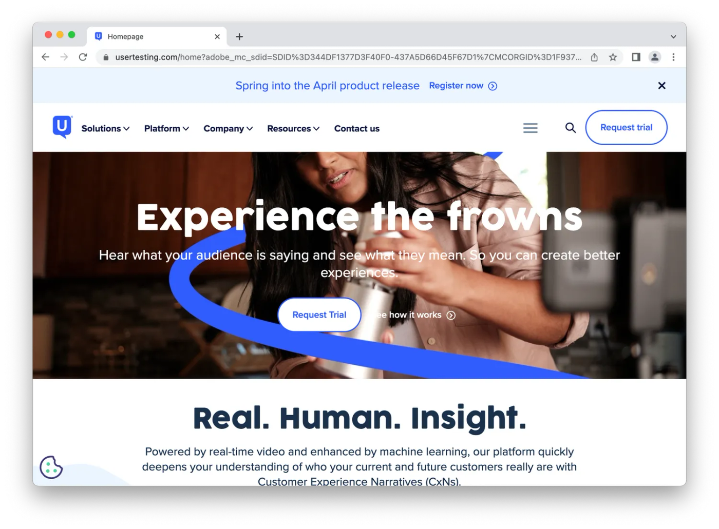 screenshot of usertesting homepage, woman testing product)