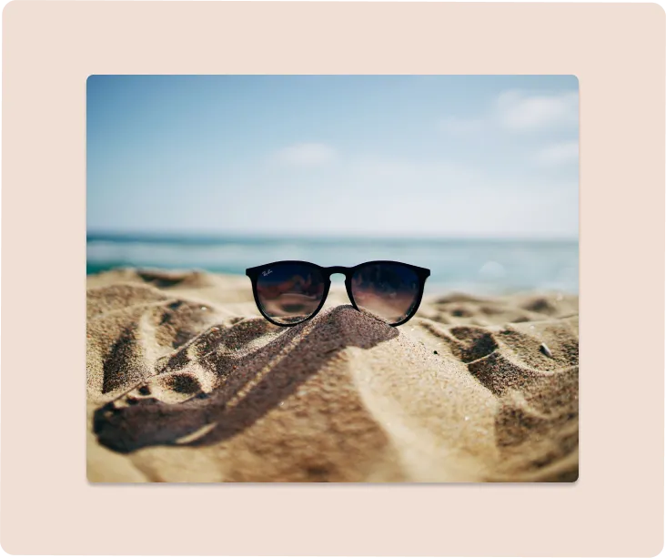 Sunglasses on sand at the beach