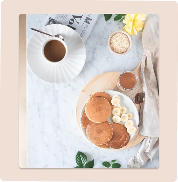 Pancakes and coffee on a marble countertop