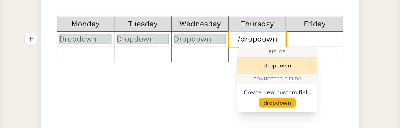 Screenshot of a partially filled table with dropdown fields in some of the cells. The text "/dropdown" has been typed into another cell, and the option to add a dropdown field appears below.